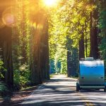 Smaller Trailer Cruising Down The Sunny Road