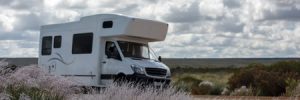 Small RV Traveling Across Road