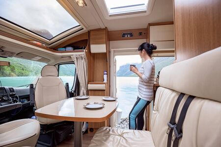 Woman standing in remodeled RV