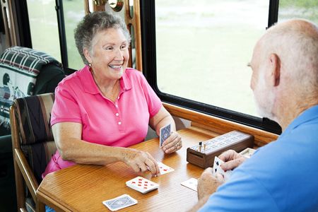 Man and Woman playing card games on Rv road trip