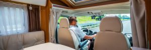 Man driving Rv on family road trip across the country