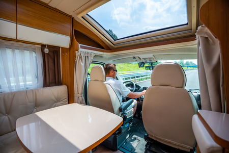 Man driving Rv on family road trip across the country